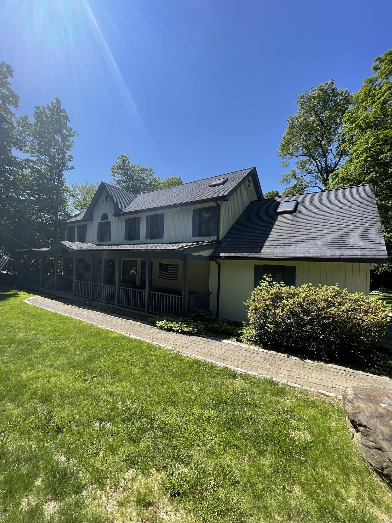 Freshly painted colonial home with wraparound porch by A-Laszlo Painting in Danbury, CT
